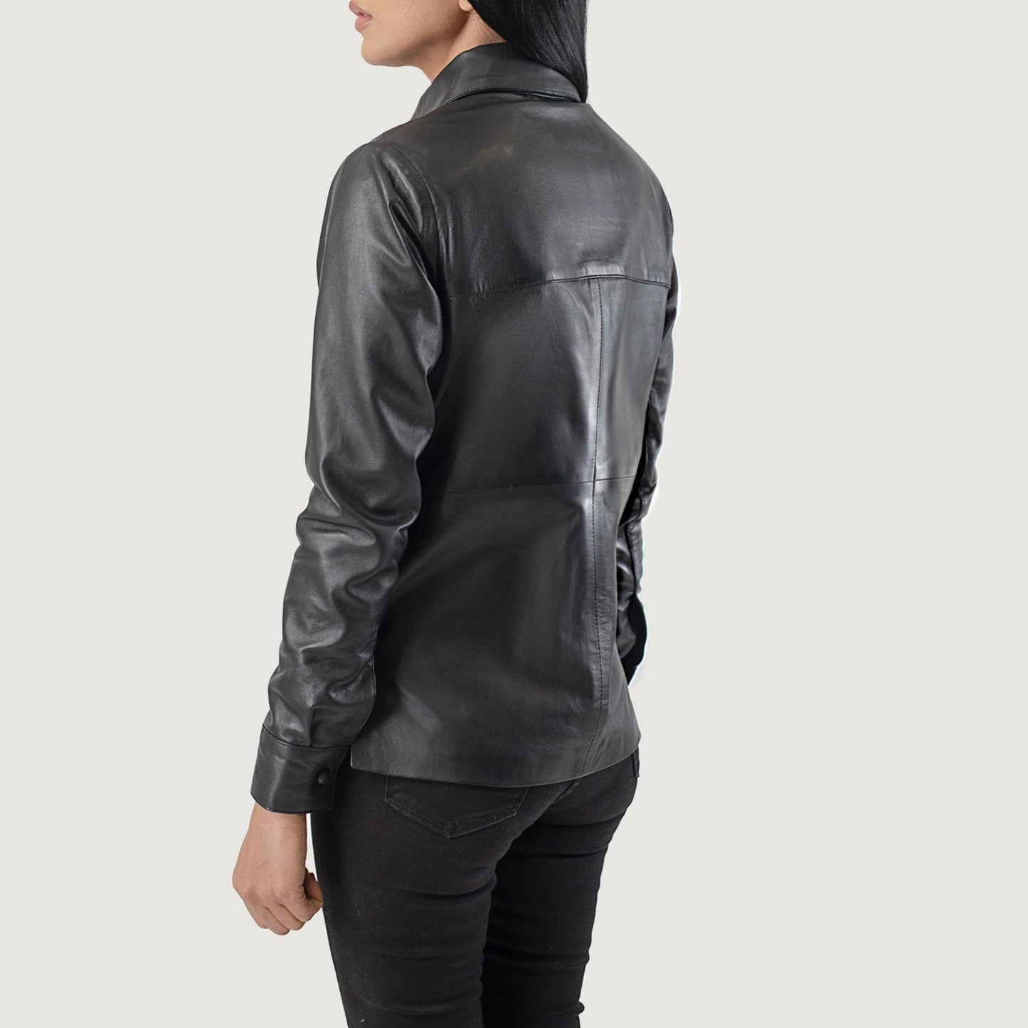 Detail of the smooth plain lining inside the black leather shirt jacket.