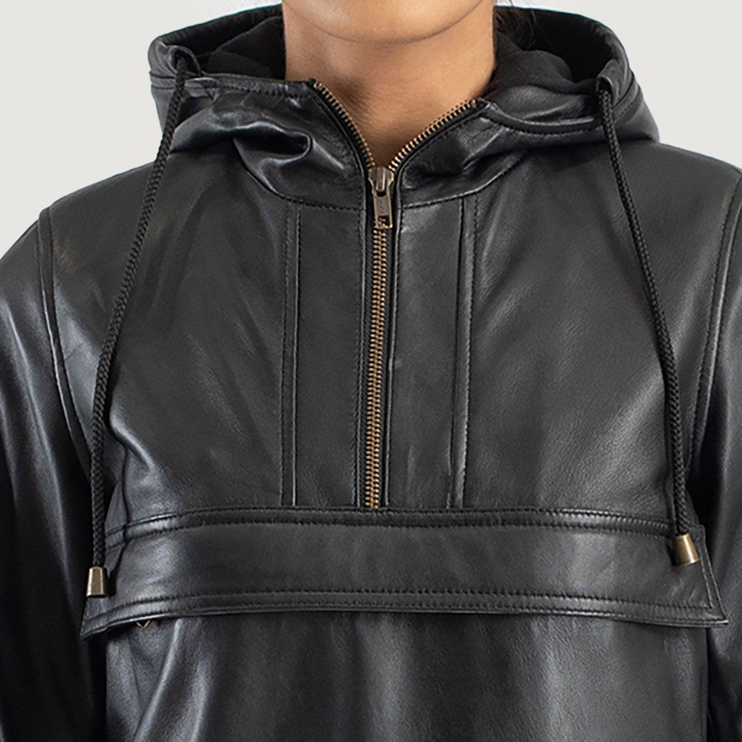 View of the practical welted waist pockets on the black leather pullover.