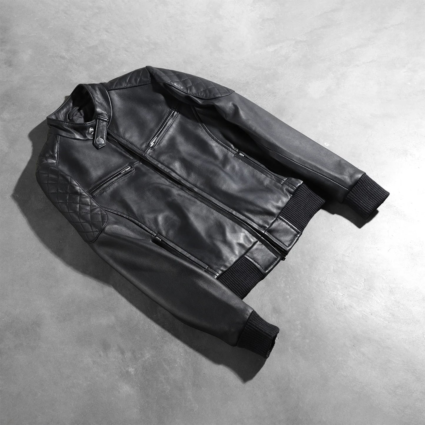 Close up of the polished front zipper closure and hardware details.