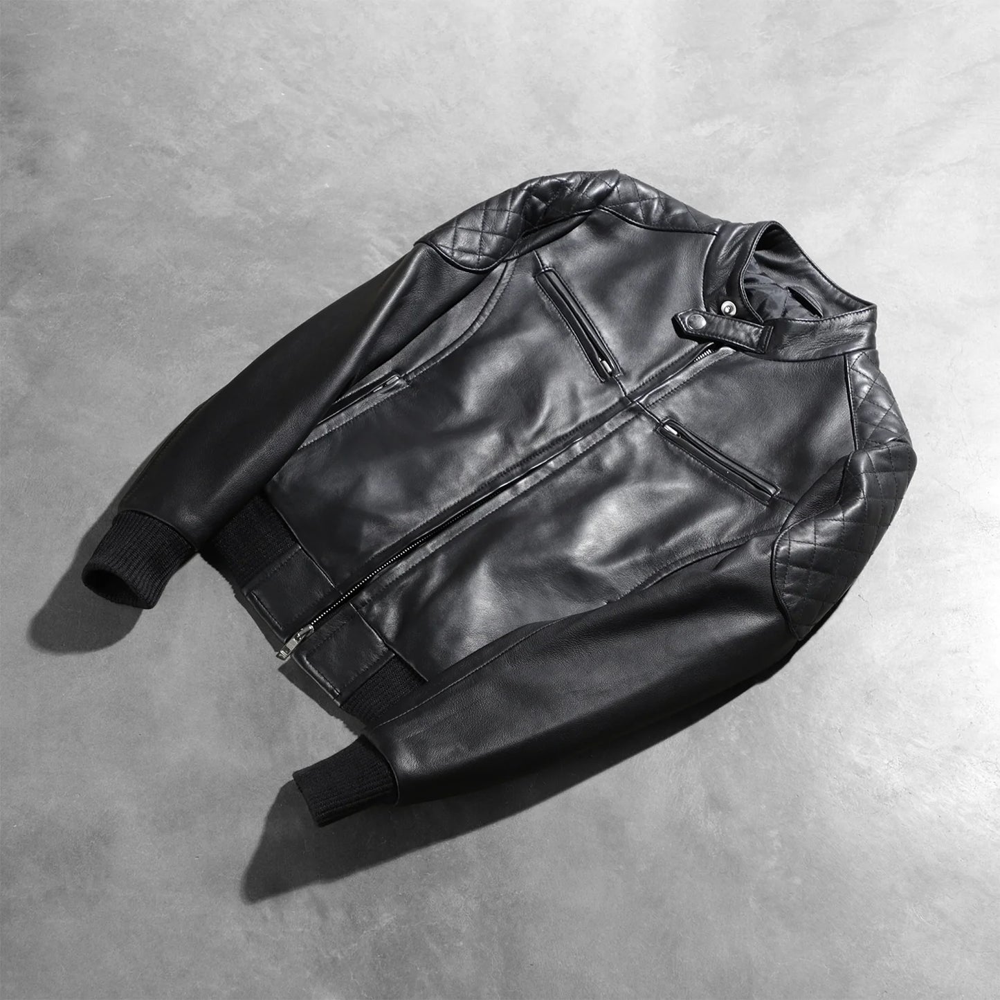 View of the two functional exterior pockets on the front of the biker jacket.