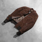 View of the four functional exterior pockets on the mocha suede bomber.