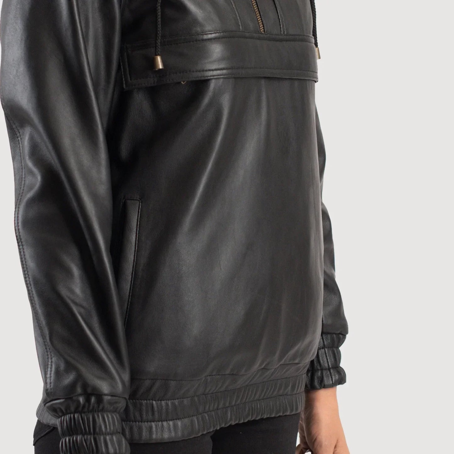 Close up of premium semi aniline sheepskin leather texture on a black hooded pullover.